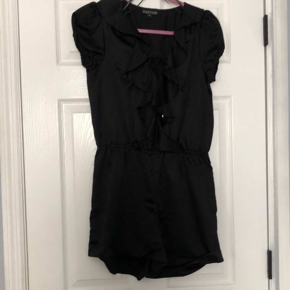 Rampage Romper black with ruffle and tie down front.